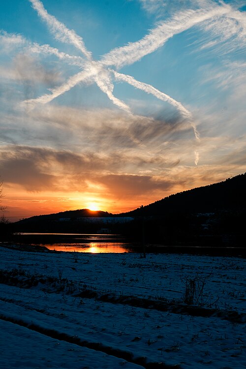 Sunset and airplane exhaust